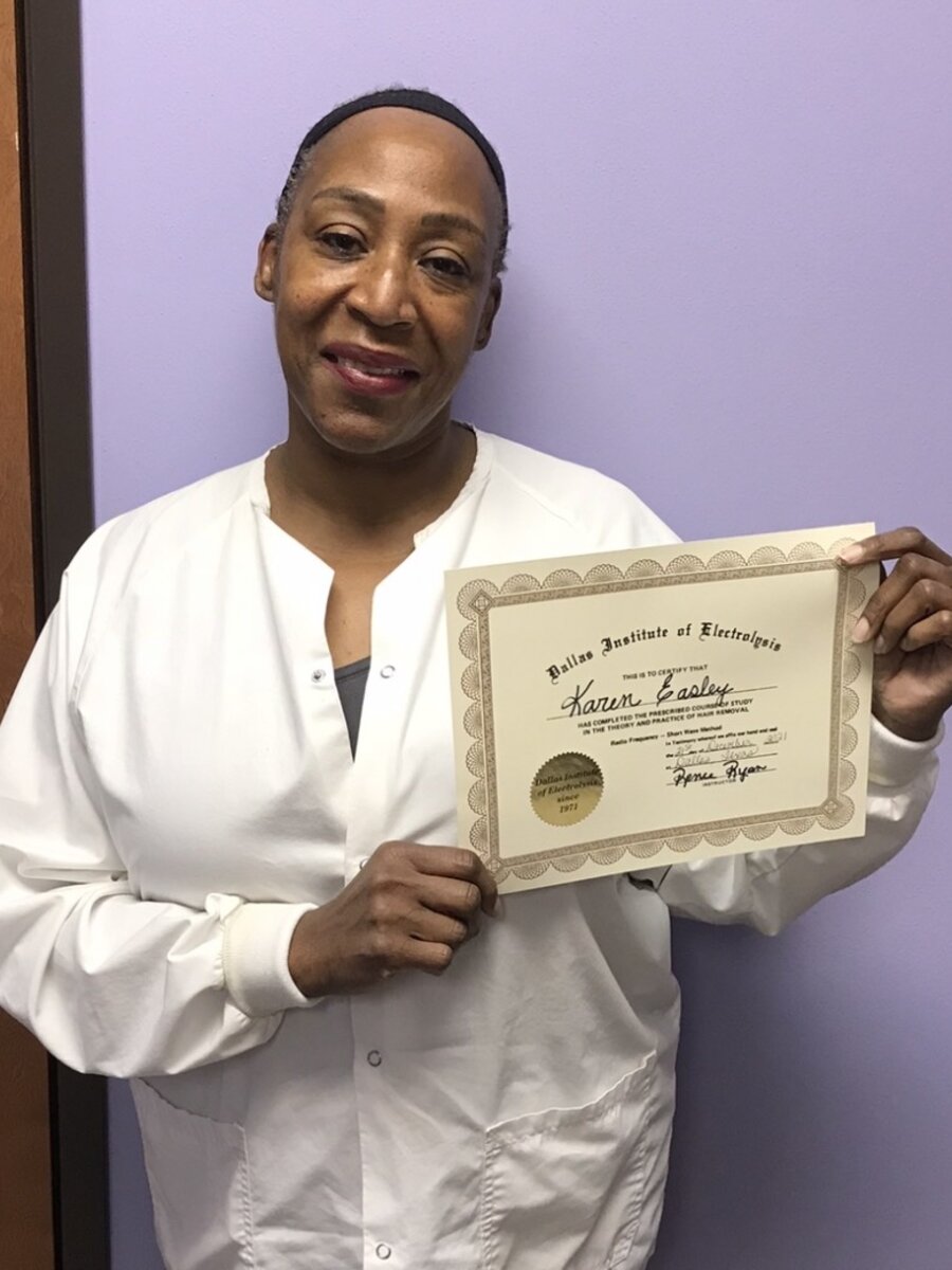 Graduate of the Dallas Institute of Electrolysis holding her certificate